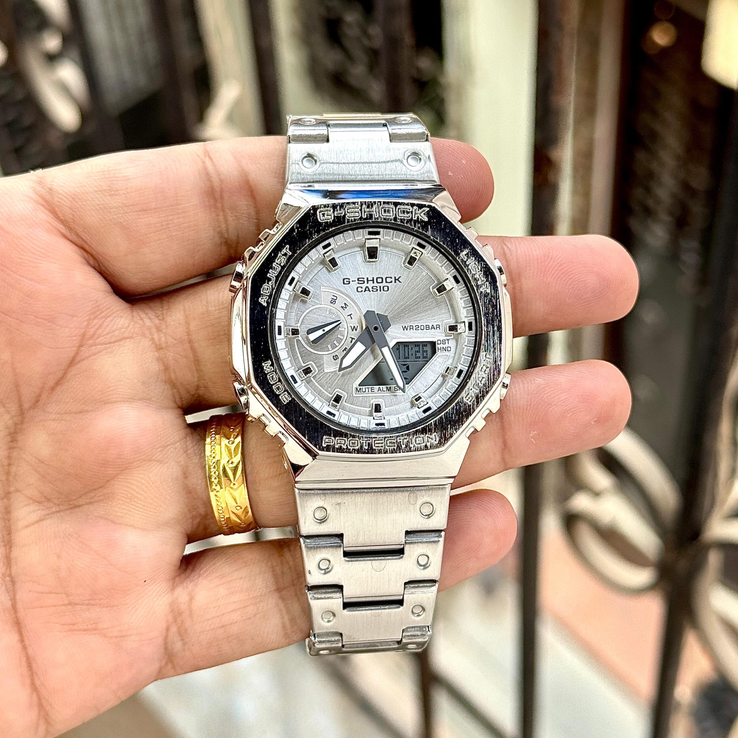 b355dfae-2cb2-4b73-8ba8-5b39116880fb Casio G-Shock “CasiOak” – Brushed Silver Dial Stainless Steel Analog-Digital Watch - Image 1